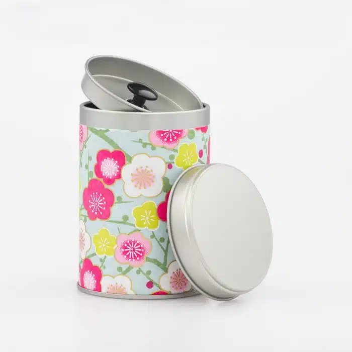 Boîte à thé Shingu 50g ouverte, montrant les deux couvercles métalliques et le design en papier washi